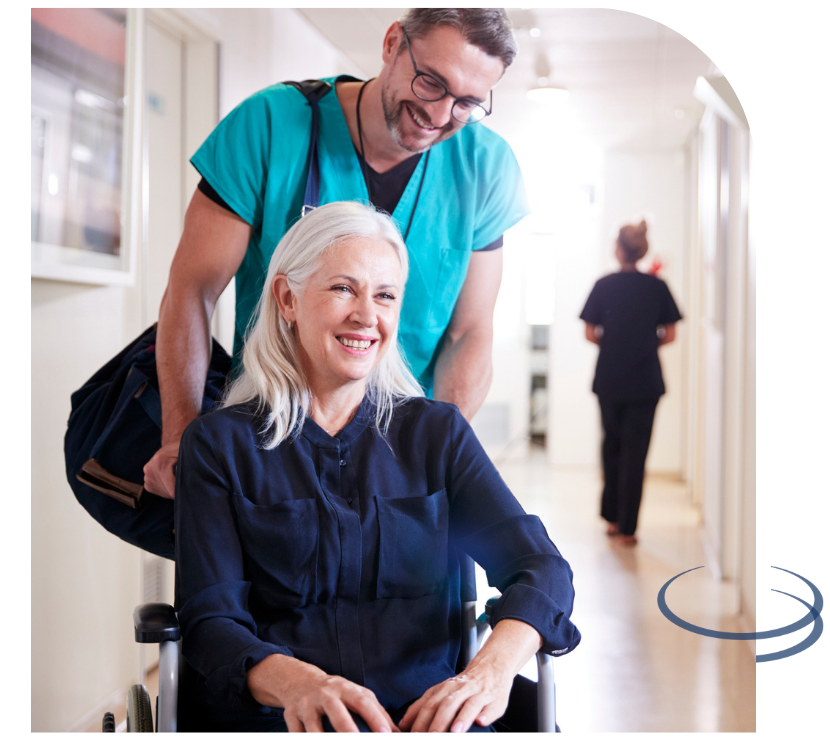 older woman smiling in wheelchair